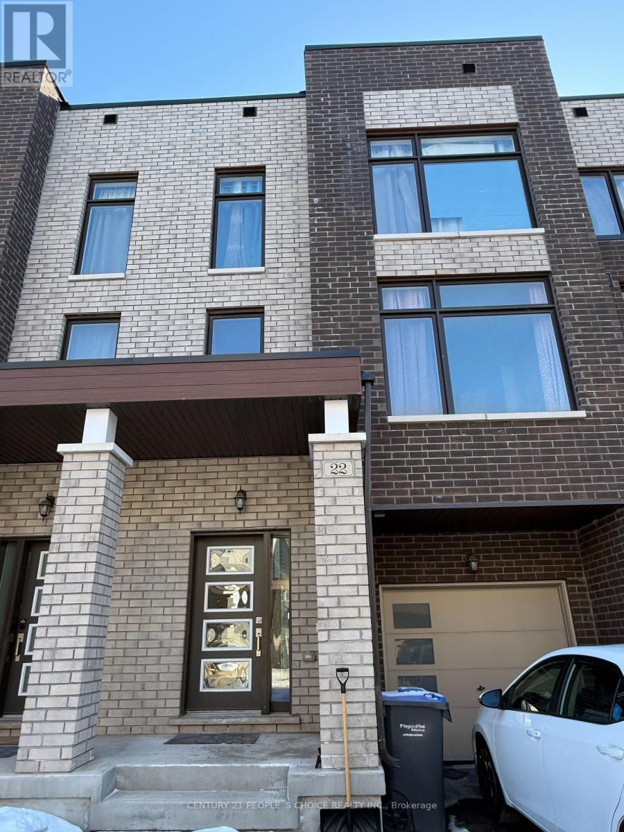 A modern brick building with a white car parked in front.