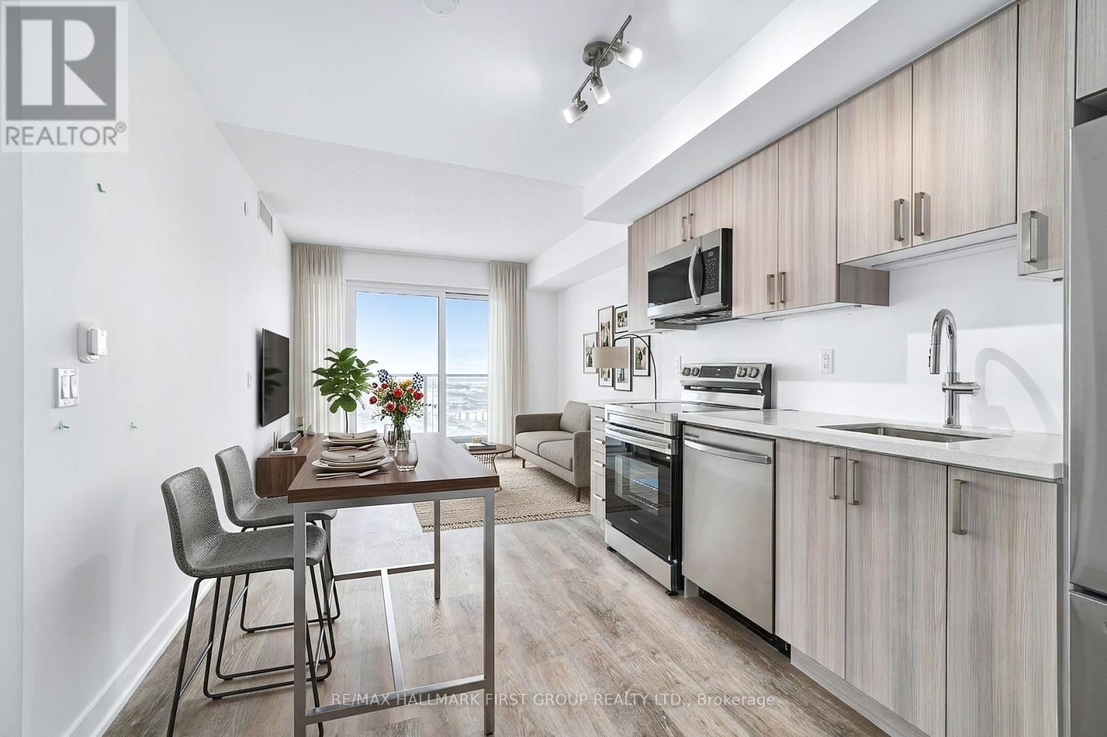 A modern kitchen with a dining table and chairs.