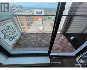 A view from a window of a building with a sign that says "US Sites".