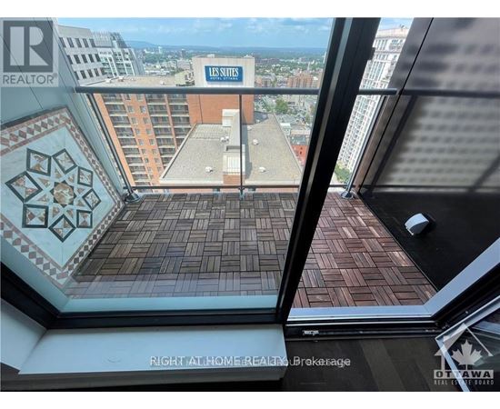 A view from a window of a building with a sign that says "US Sites".