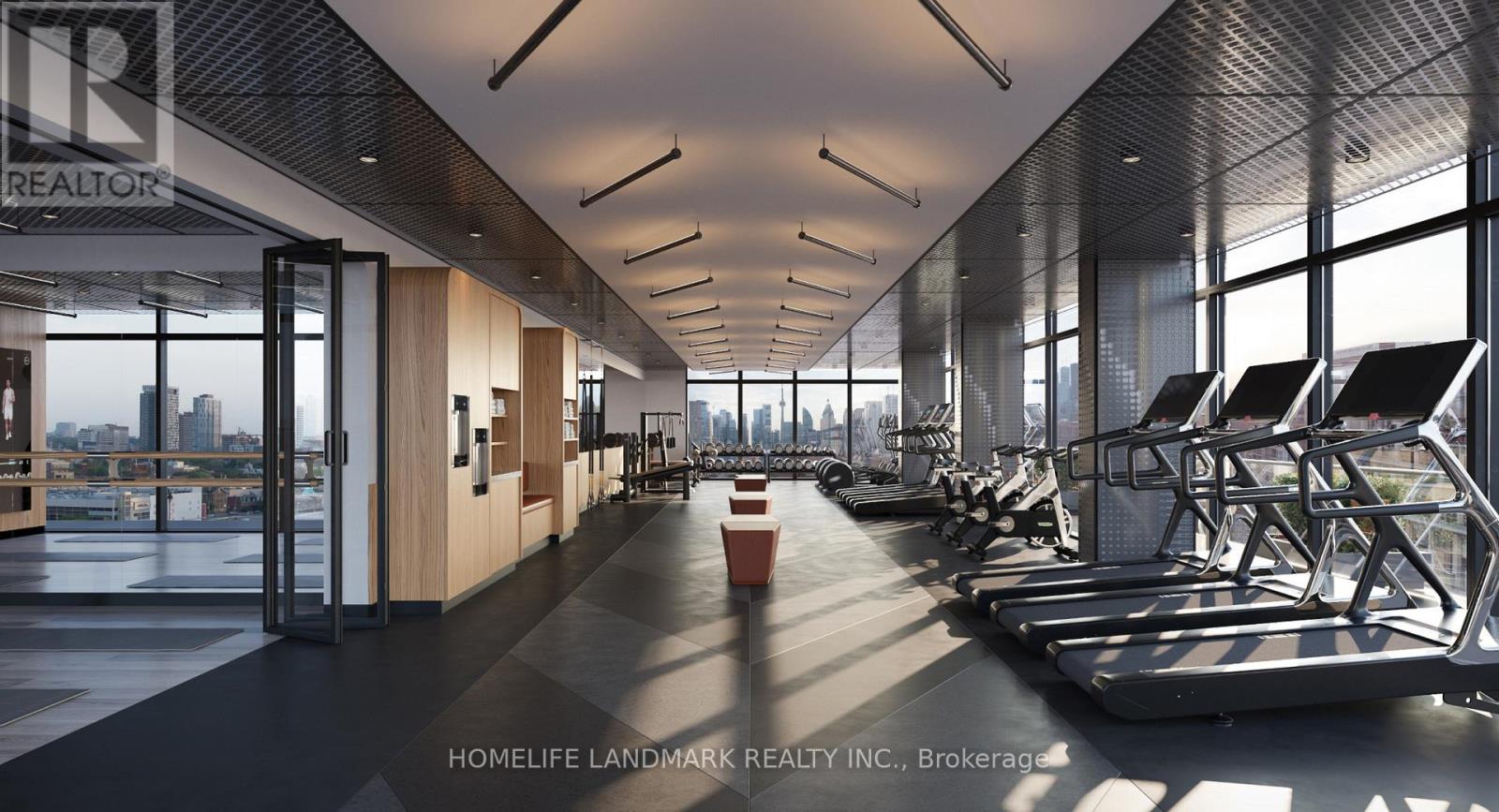 A gym with treadmills and a view of the city.