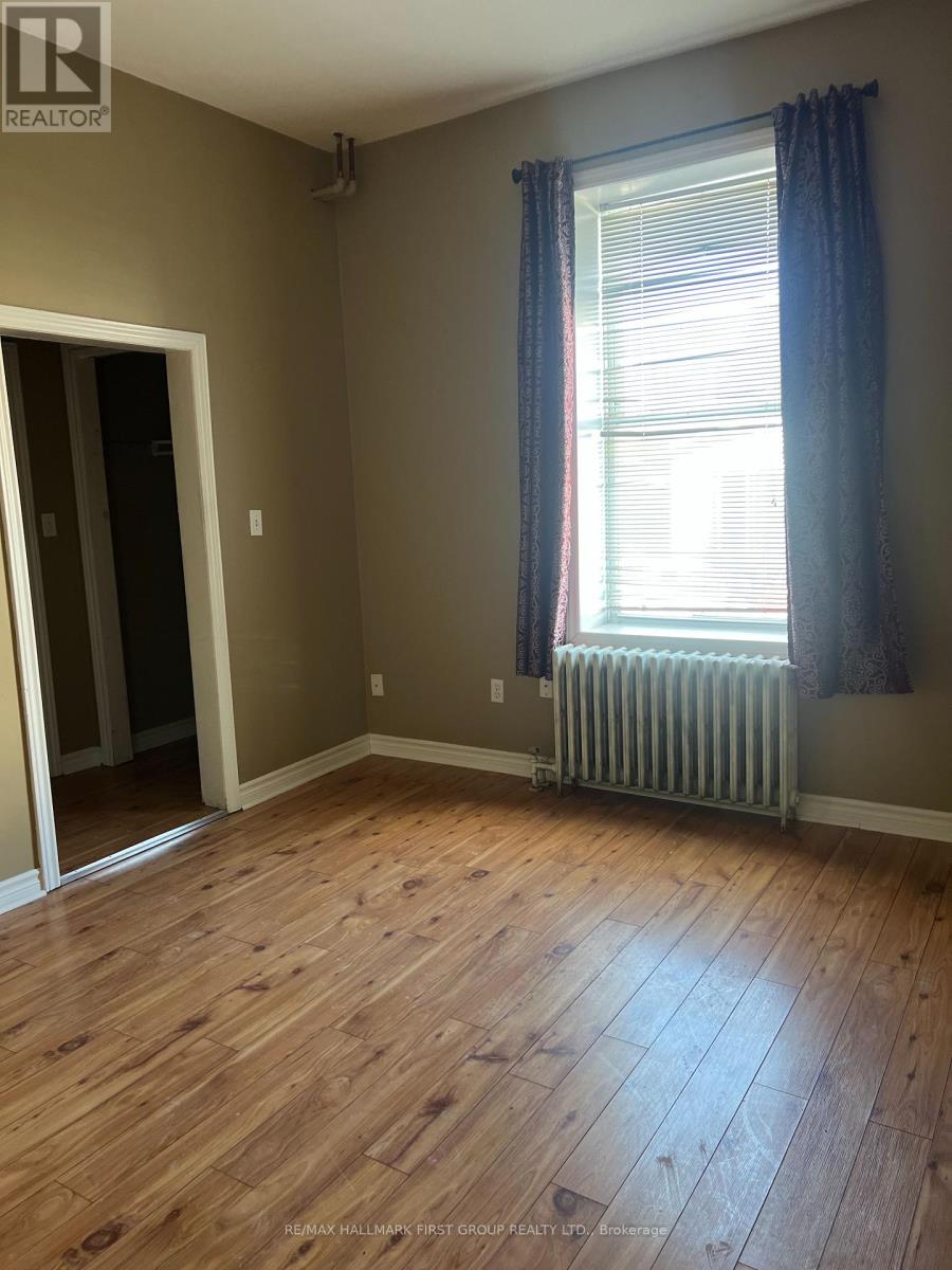 A room with a window and a radiator.