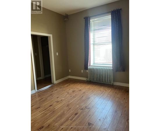A room with a window and a radiator.