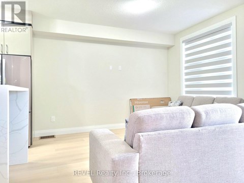 A living room with a couch and a chair.