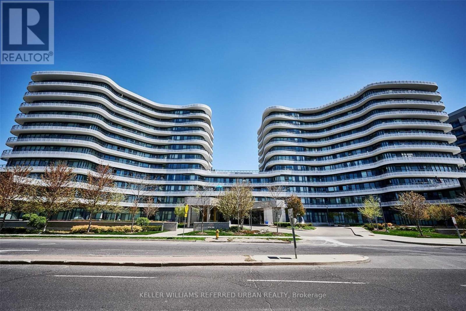 A modern building with curved balconies is shown in the image.