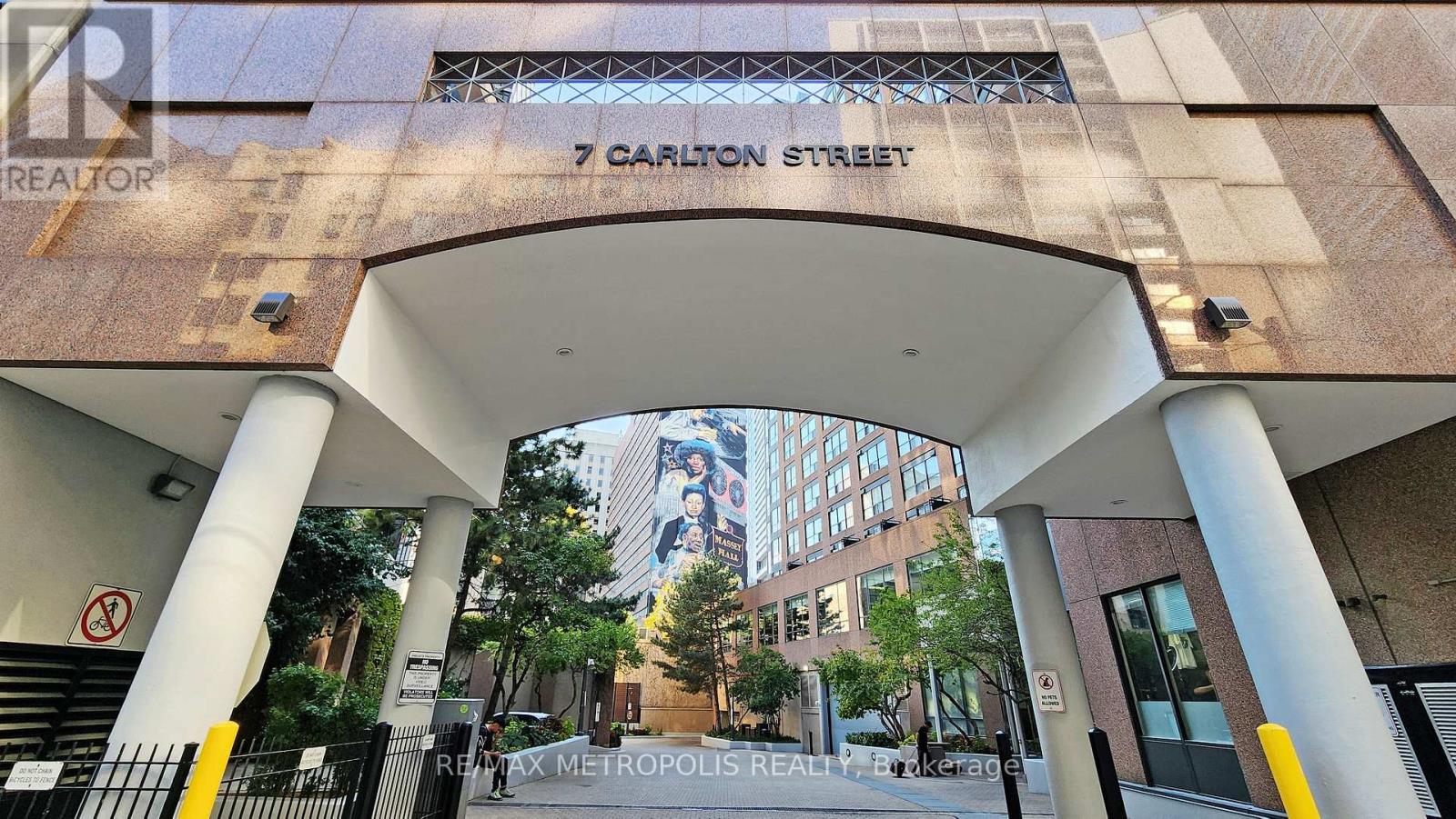 A building entrance with a sign that says 7 Carlton Street.