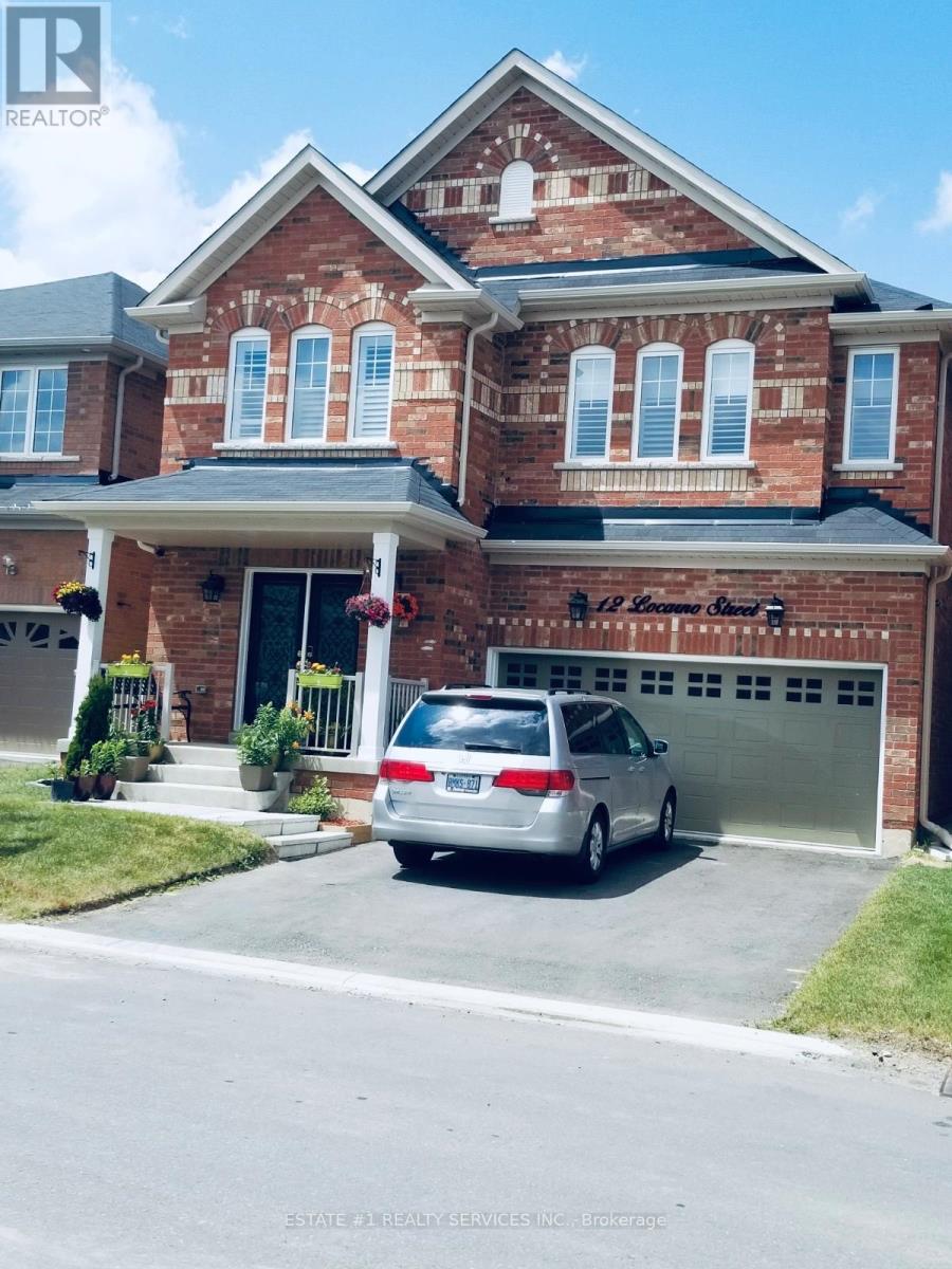 A house with a car parked in front of it.