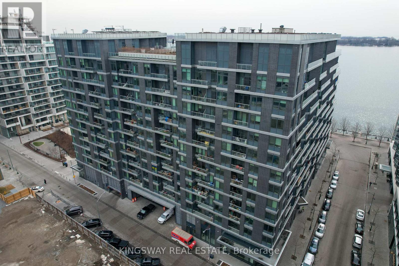 A large building with a lot of windows is under construction.