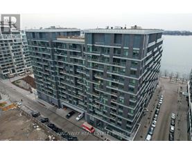 A large building with a lot of windows is under construction.