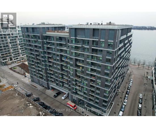 A large building with a lot of windows is under construction.