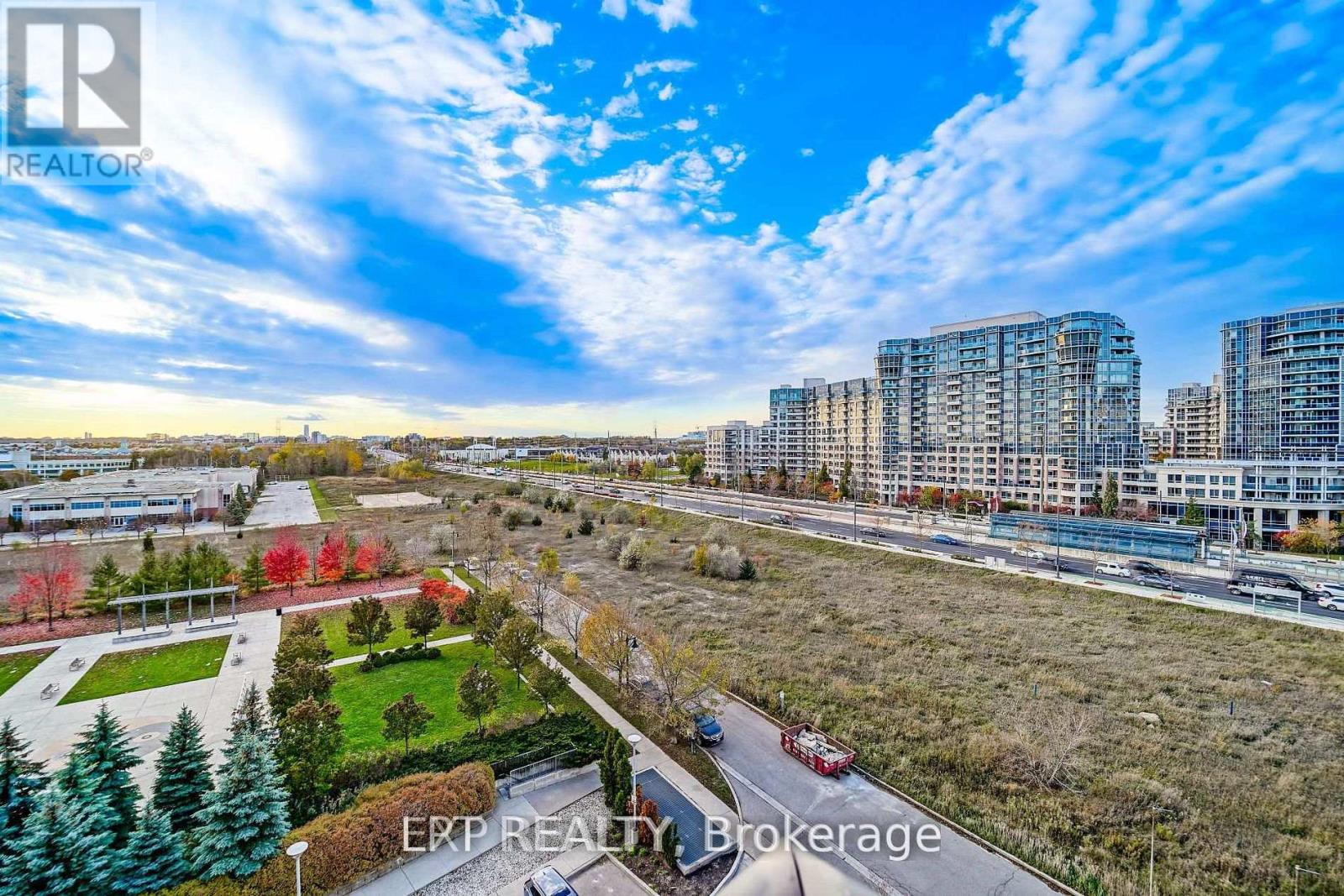 A real estate brokerage logo is superimposed on a picture of a cityscape.