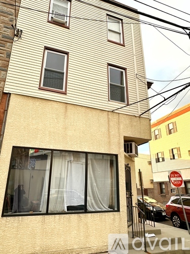 A building with a sign that says "No Parking" in front of it.