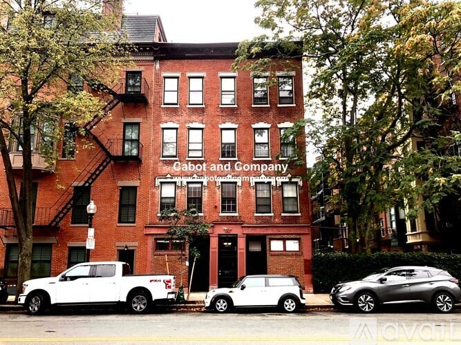 A red brick building with the name "Cabot and Company" on the front.
