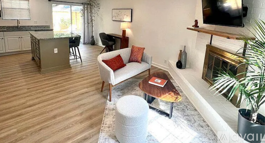 A living room with a fireplace and a couch.