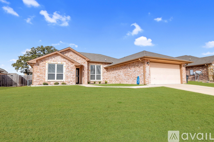 A house with a large lawn is for sale.