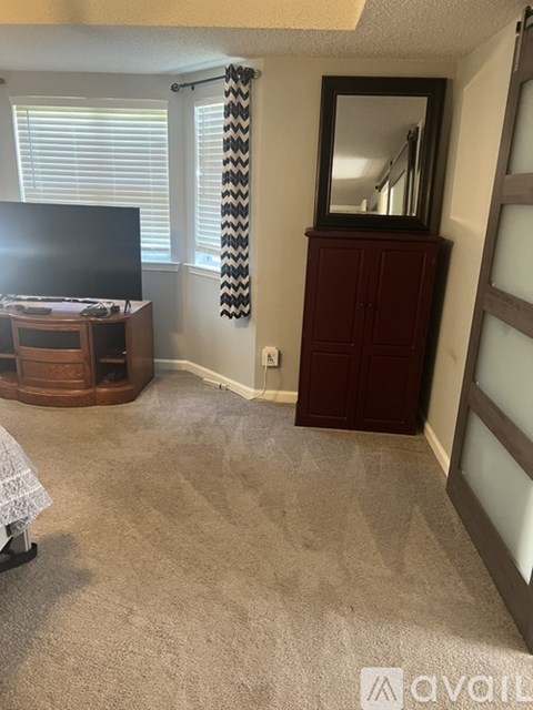 A bathroom with brown walls and a white toilet.