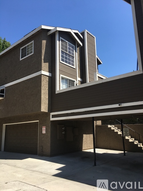 A two-story building with a garage on the ground floor.