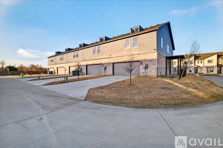 A large building with a driveway in front of it.