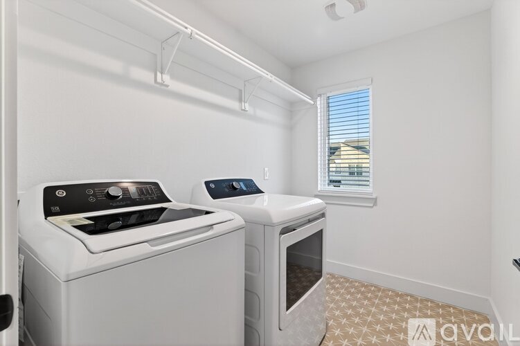 A white kitchen with a stove and oven.