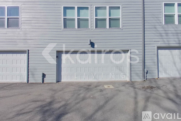 A grey building with the word "kairos" written on it.