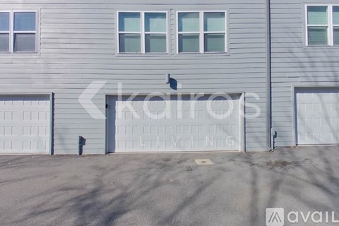 A grey building with the word "kairos" written on it.