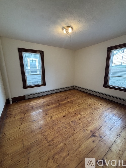 A kitchen with a table and chairs in the middle of the room.
