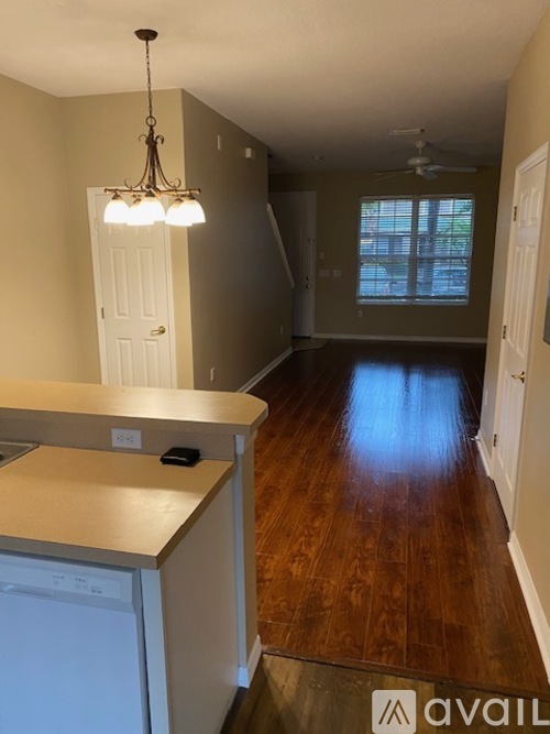 A kitchen with a washer and dryer built in.