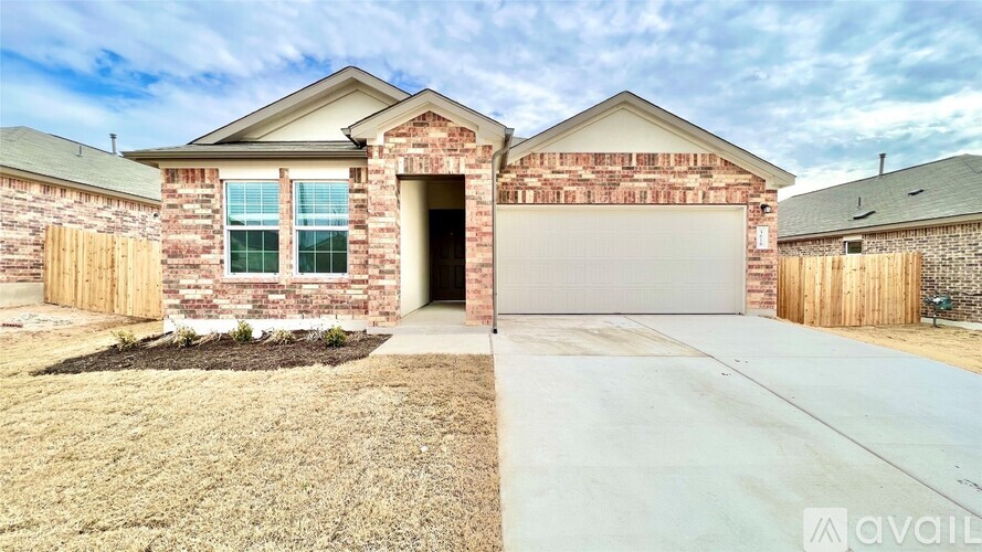 A house with a brick facade and a garage door.