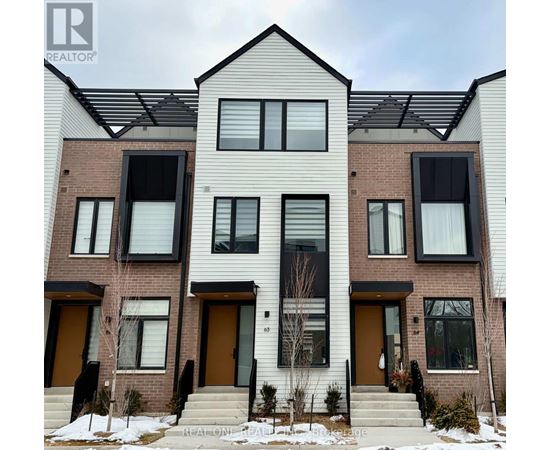 A modern two-story residential building with a mix of brick and siding exterior.