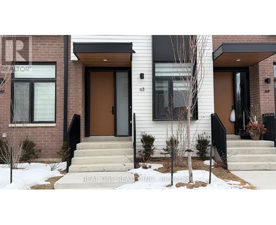 A house with a brown door and a sign that says "REAL ONE REALTOR".