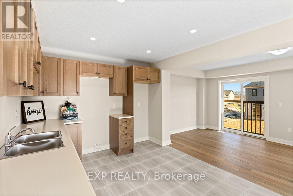 A kitchen with wooden cabinets and a sink.
