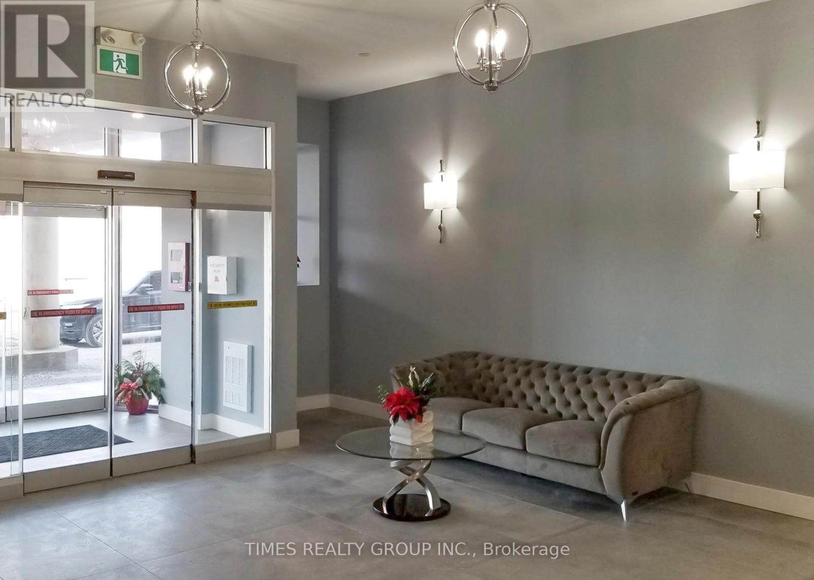 A waiting area with a couch, chairs, and a coffee table.