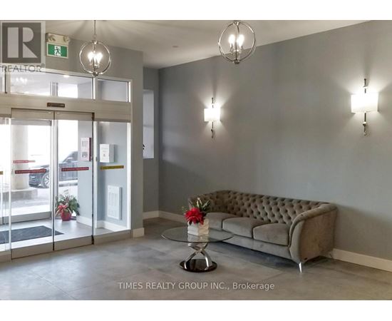 A waiting area with a couch, chairs, and a coffee table.