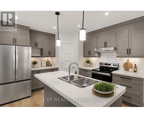 A modern kitchen with a stainless steel refrigerator and a central island with a sink.