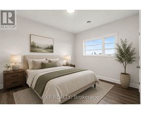 A bedroom with a bed, nightstands, and a potted plant.