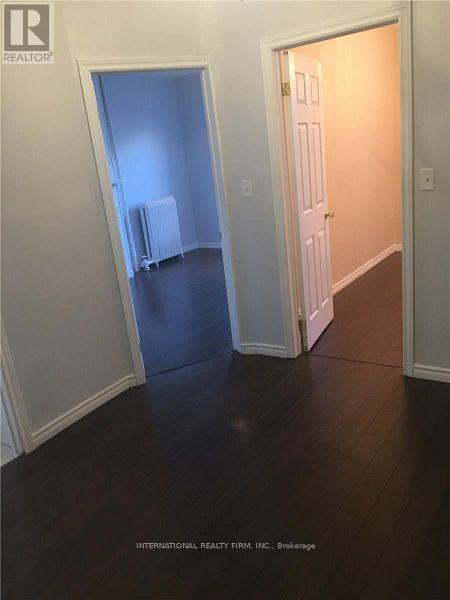 A room with a doorway leading to another room.
