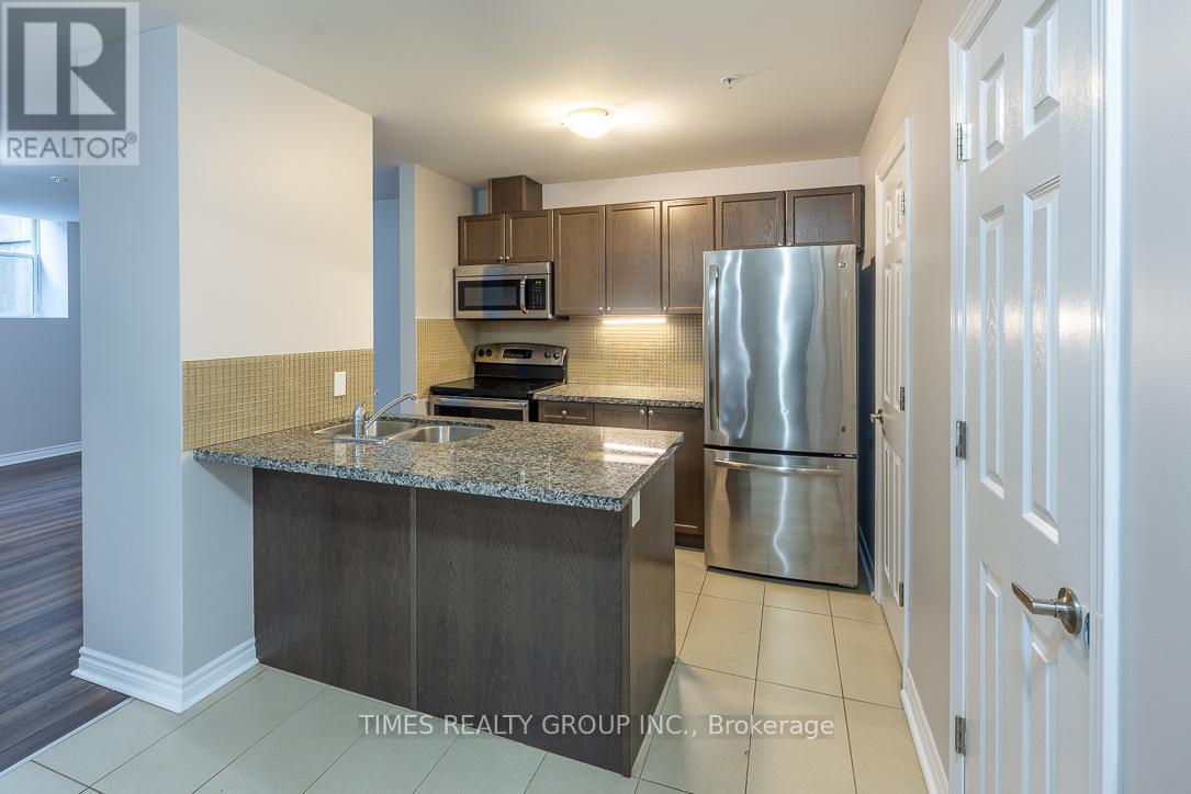 A kitchen with granite countertops and stainless steel appliances.