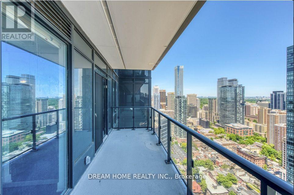 A balcony with a view of the cityscape.