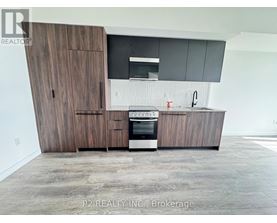 A modern kitchen with dark wood cabinets and a stainless steel oven.