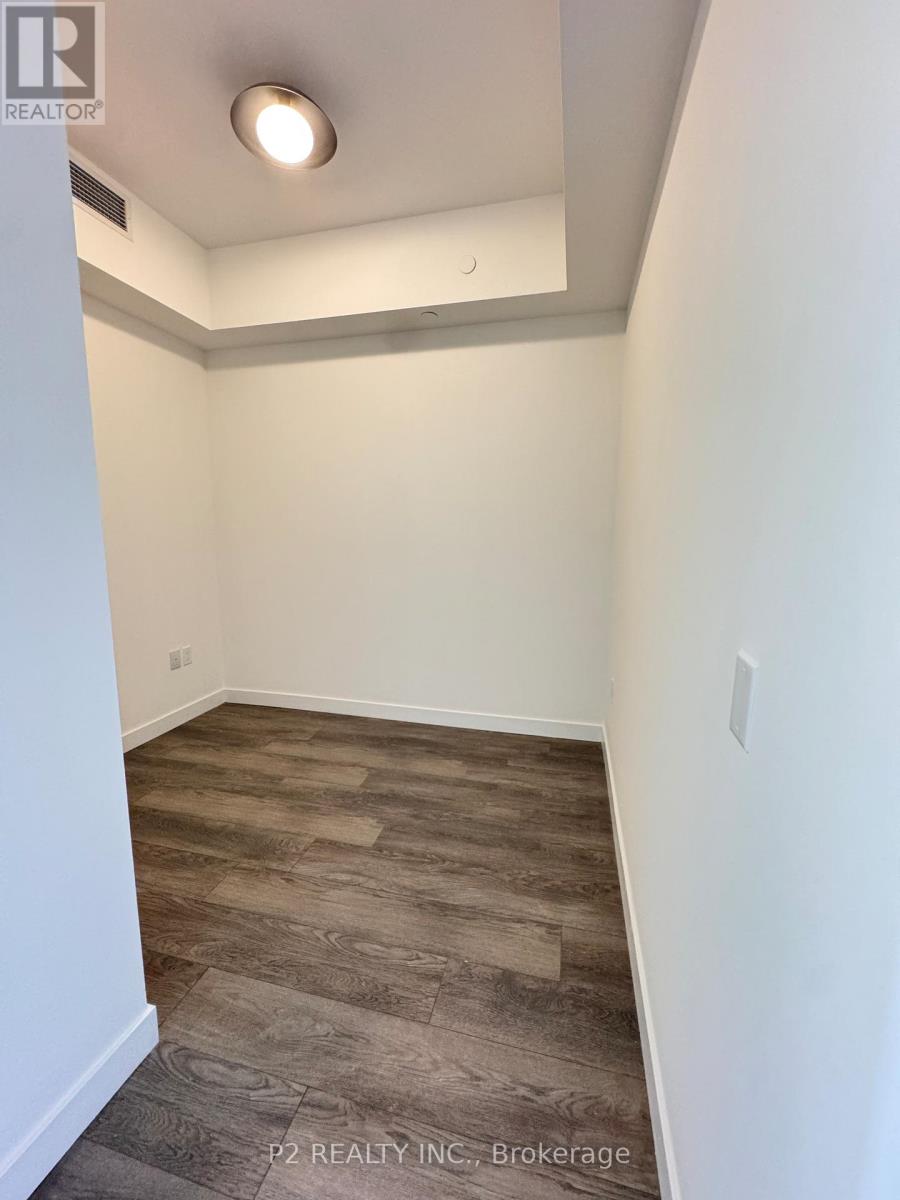 A room with a wooden floor and white walls.