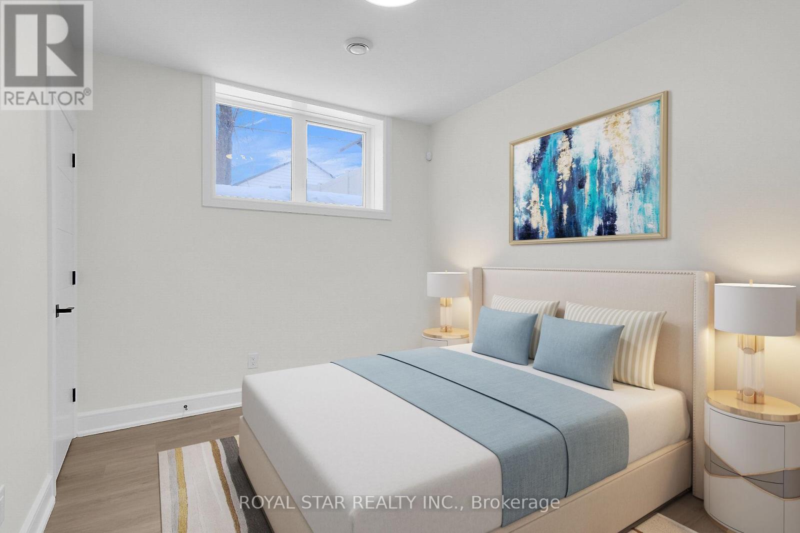 A bedroom with a bed, nightstands, and a painting on the wall.