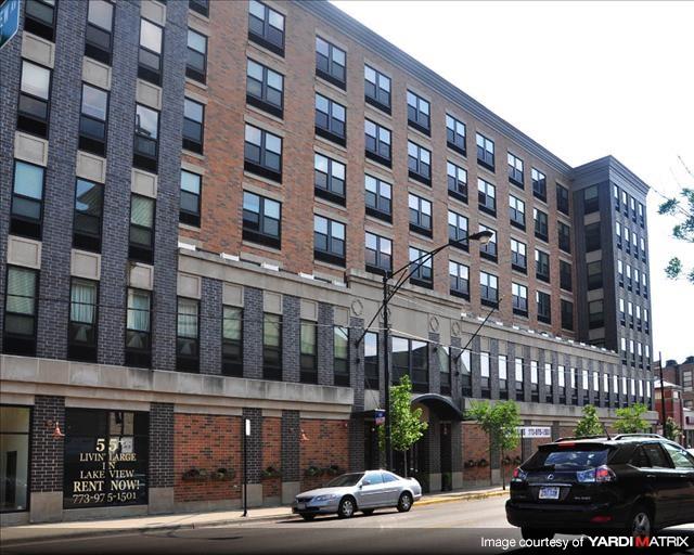 a large building with a car parked in front of it
