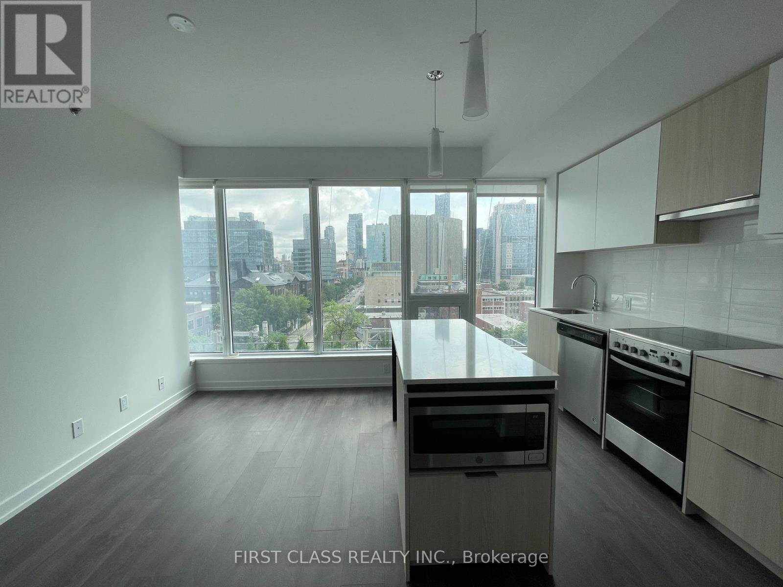 A modern kitchen with a view of the city.
