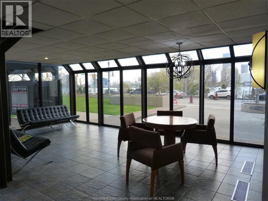 A large conference room with a table and chairs.