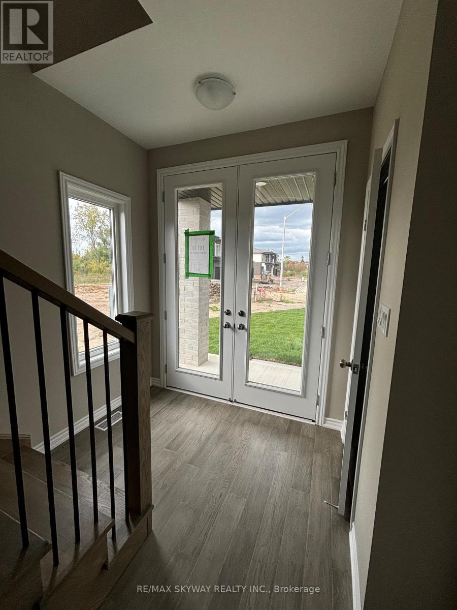 A view from the staircase looking out through a sliding glass door.