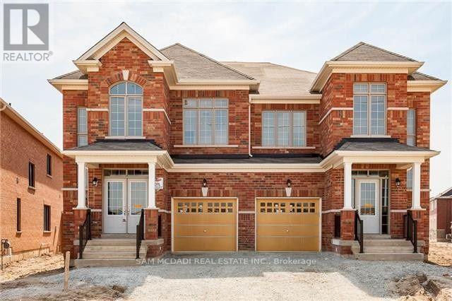 A large brick house with a garage in front.