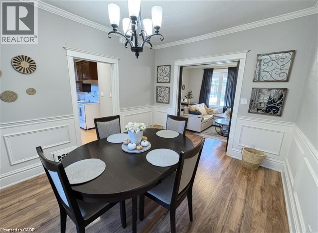 A dining room with a table set for four.