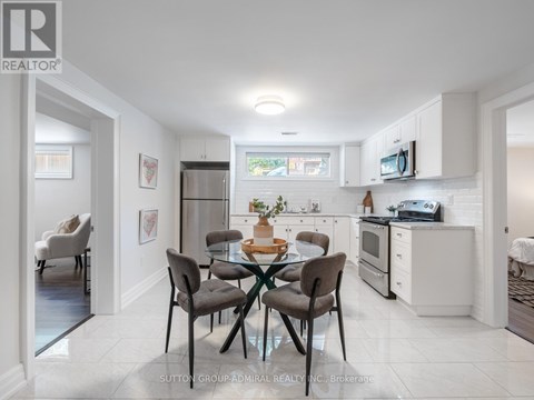 A modern kitchen with a dining table set for four.