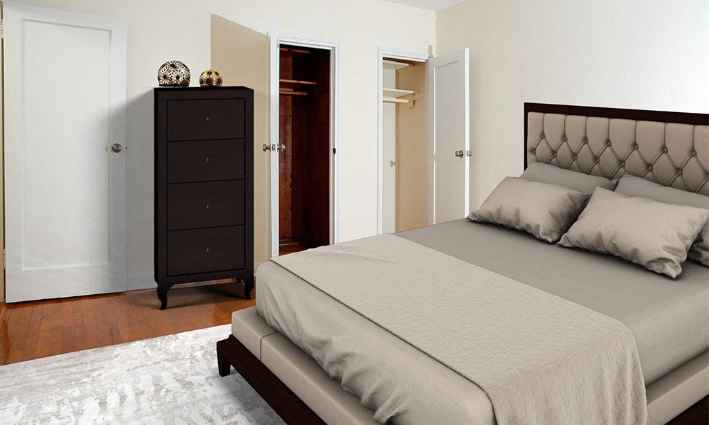 a bedroom with a bed and a dresser