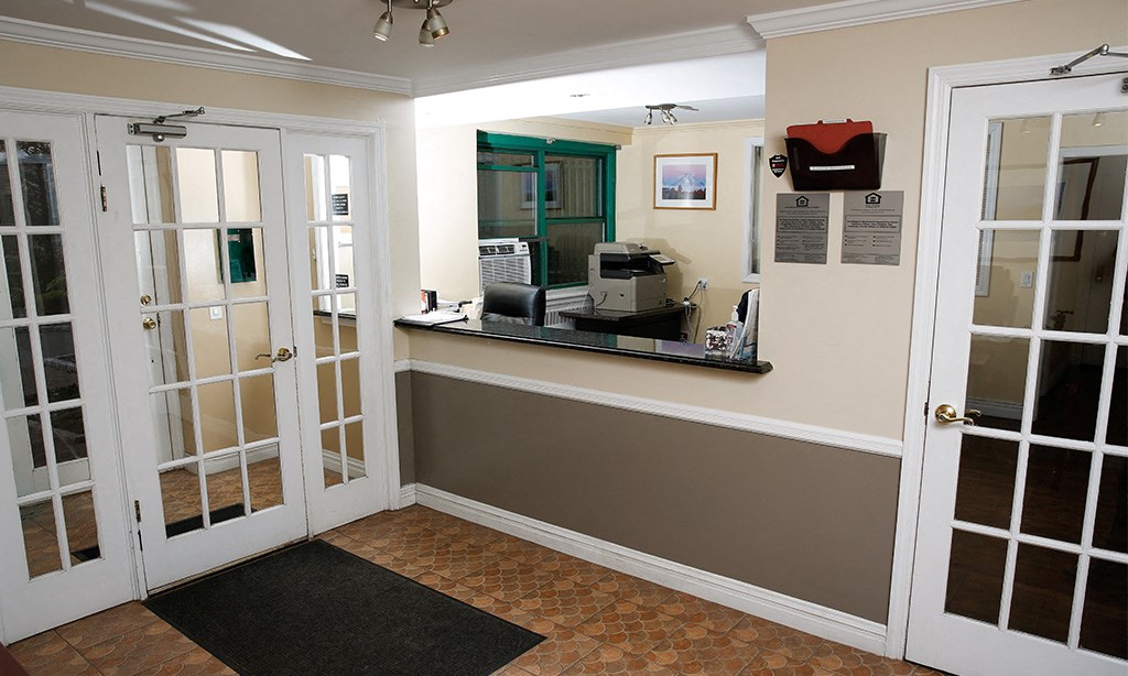 the entrance to a kitchen doors and a mirror
